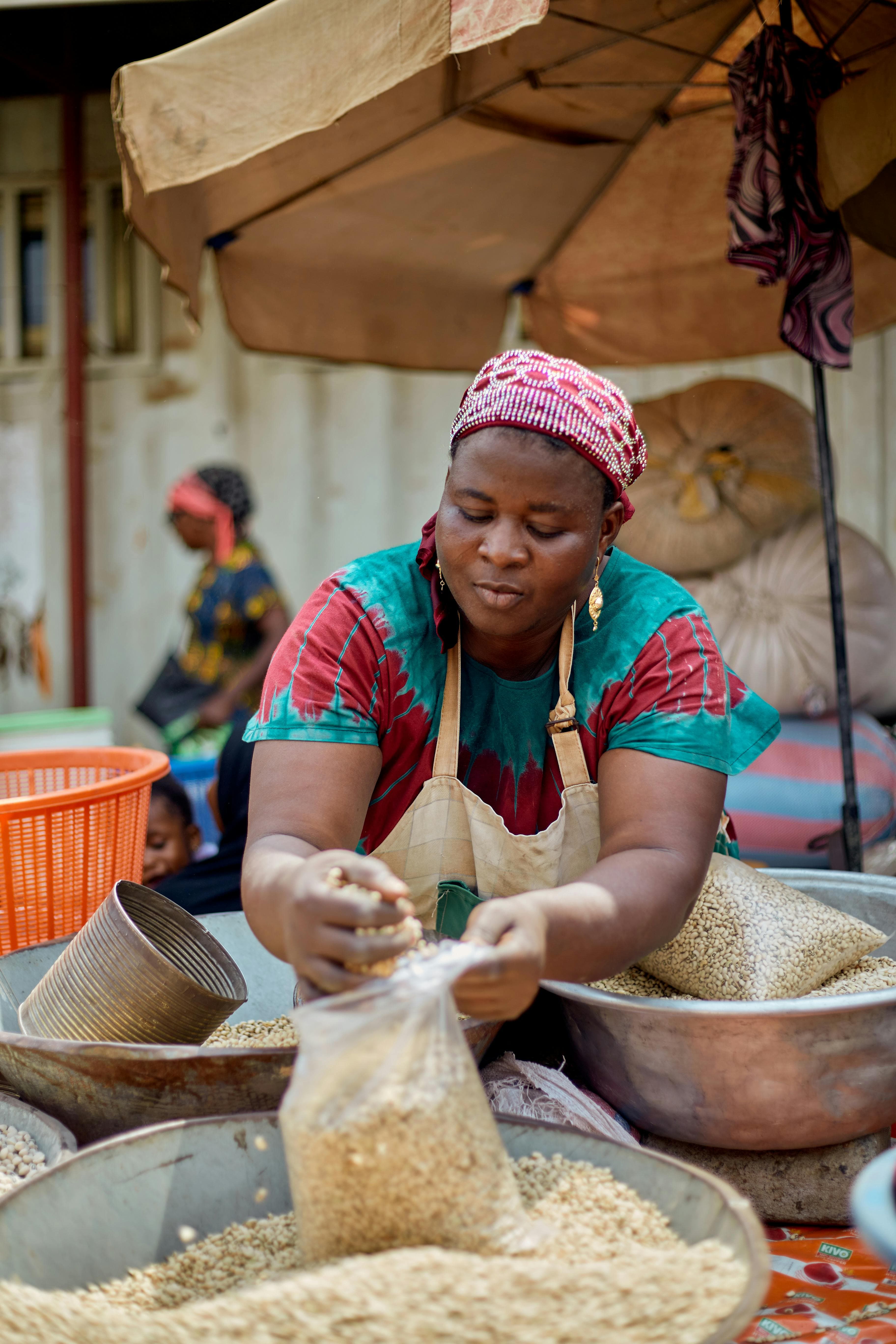 Vendor selling beans at a Ghana market